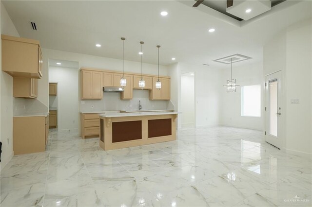kitchen with marble finish floor, under cabinet range hood, and recessed lighting