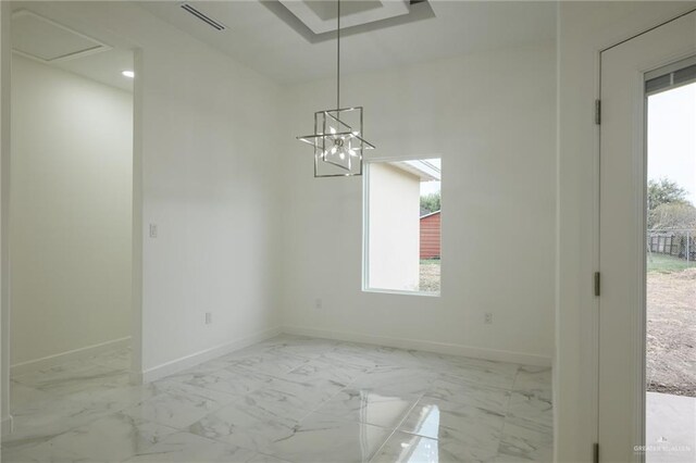 unfurnished dining area with an inviting chandelier, marble finish floor, baseboards, and visible vents