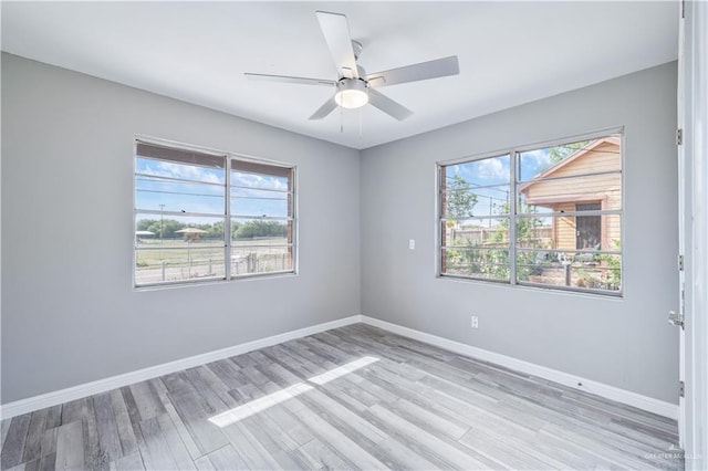 406 N Fairgrounds Rd, Rio Grande City, TX 78582 - unfurnished room featuring light wood-style flooring, baseboards, and a ceiling fan