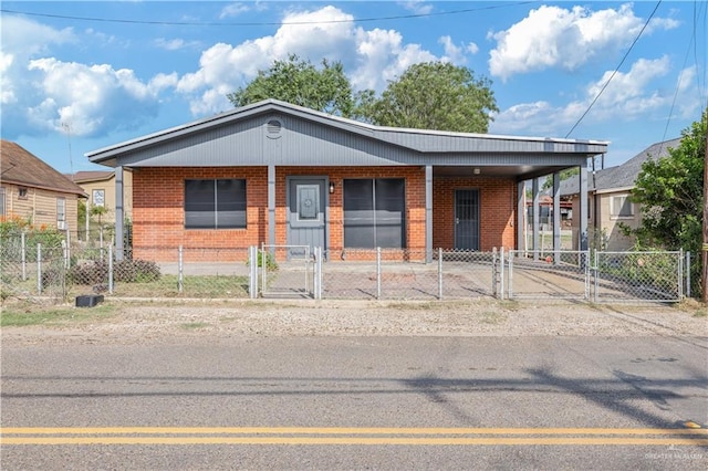 406 N Fairgrounds Rd, Rio Grande City, TX 78582 - view of front of property featuring a gate, brick siding, and a porch