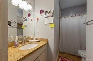 2105 Treasure Oaks Dr, Harlingen, TX 78550 - bathroom featuring vanity, toilet, and a shower with curtain