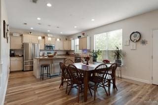 2105 Treasure Oaks Dr, Harlingen, TX 78550 - dining area with light wood-style flooring, recessed lighting, and baseboards