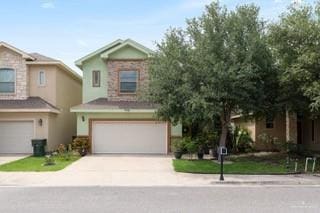 2105 Treasure Oaks Dr, Harlingen, TX 78550 - view of front of property featuring a garage and driveway