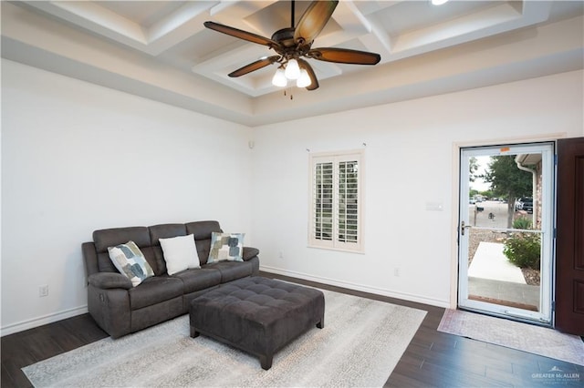 living room with ceiling fan, beamed ceiling, and dark hardwood / wood-style floors