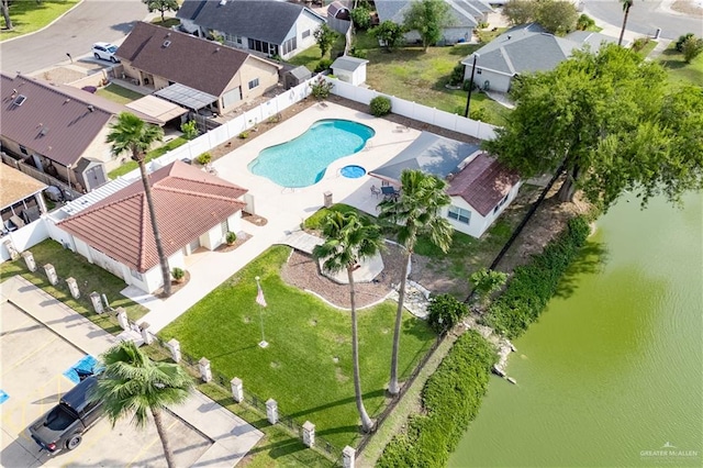 birds eye view of property featuring a water view