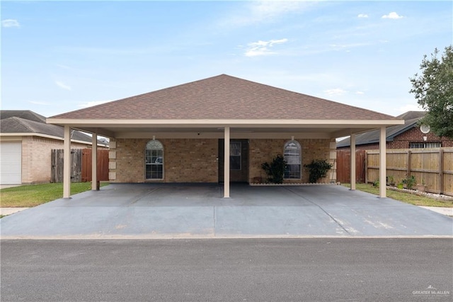 ranch-style home featuring a carport