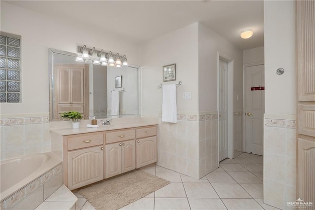 2008 Mesquite St, Edinburg, TX 78539 - full bath with tile walls, tile patterned floors, wainscoting, a bath, and vanity