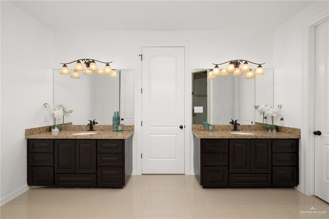 bathroom featuring tile patterned flooring and vanity