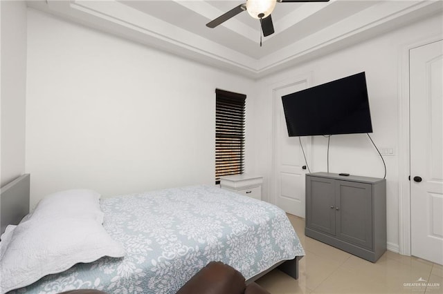 bedroom with ceiling fan and light tile patterned flooring