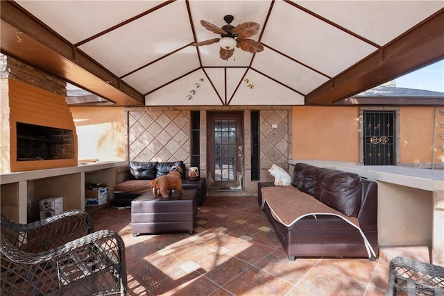 interior space featuring vaulted ceiling and a ceiling fan