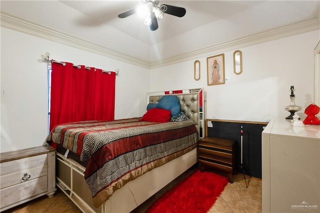 bedroom with a ceiling fan, crown molding, and tile patterned floors