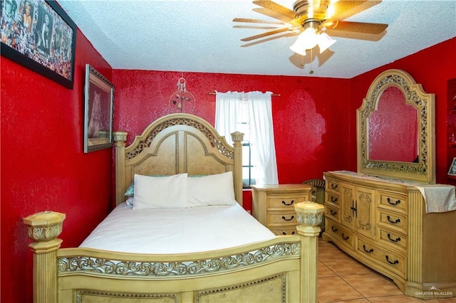 3008 W 45th St, Mission, TX 78574 - bedroom with a textured ceiling, tile patterned floors, and a ceiling fan