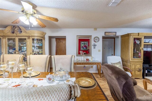 3008 W 45th St, Mission, TX 78574 - dining area featuring a textured ceiling and a ceiling fan