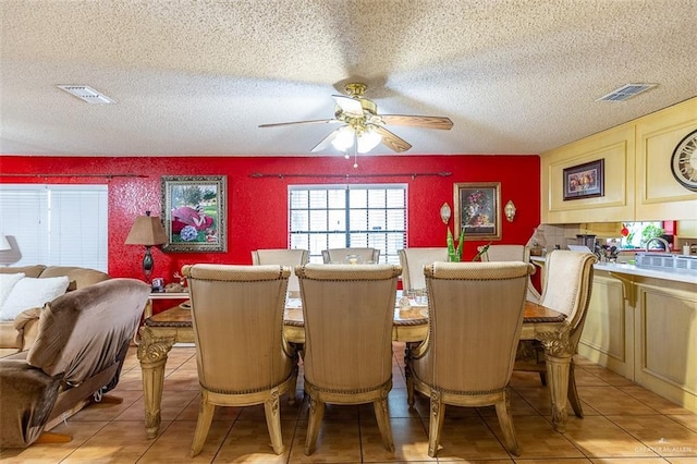 3008 W 45th St, Mission, TX 78574 - dining space featuring ceiling fan, light tile patterned flooring, and a textured ceiling