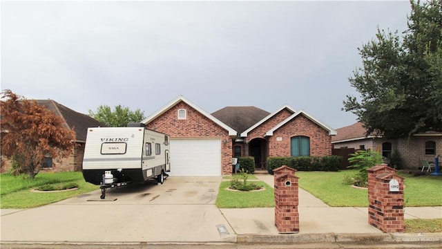 ranch-style home with a garage and a front lawn