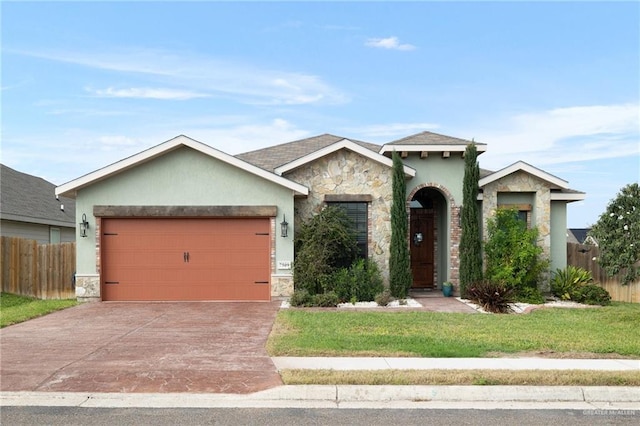 view of front of house featuring a front lawn and a garage