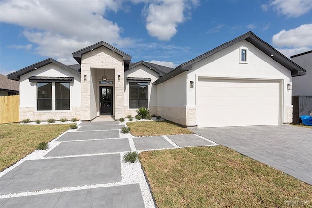 view of front facade featuring a front lawn and a garage