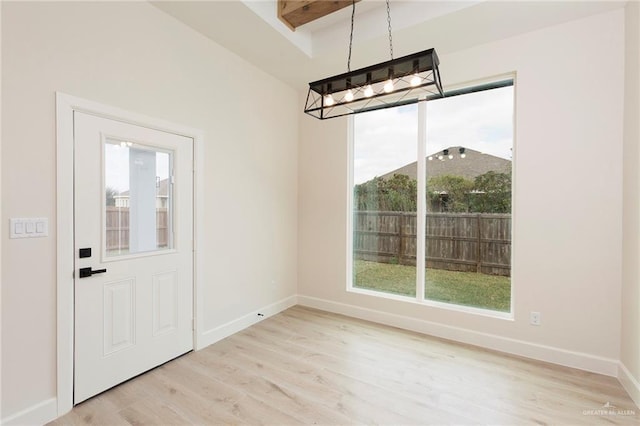 unfurnished dining area with light wood-type flooring