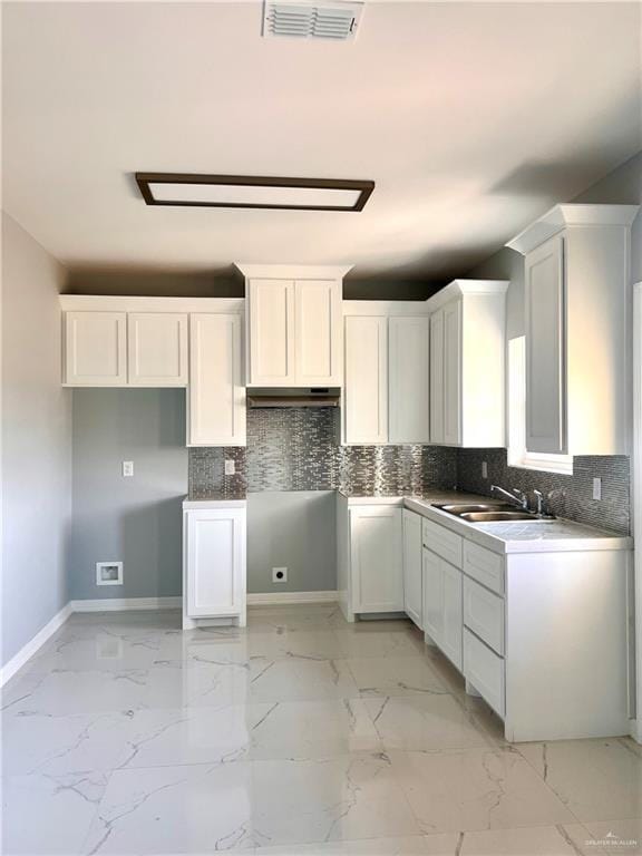 kitchen with sink and white cabinets