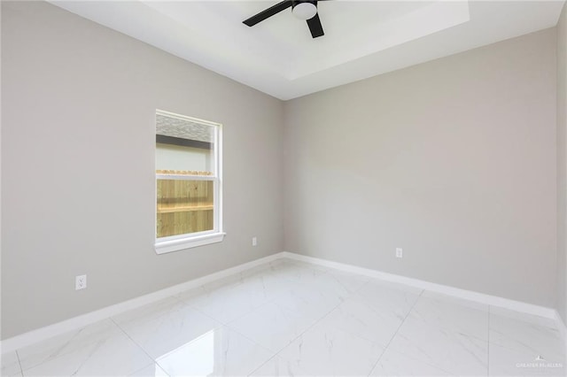 9206 N 25th Ln, Mcallen, TX 78504 - spare room featuring baseboards, ceiling fan, and light marble finish flooring