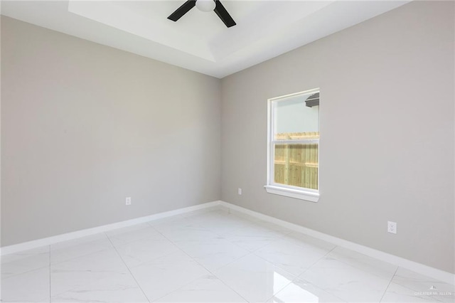 9206 N 25th Ln, Mcallen, TX 78504 - empty room featuring light marble finish flooring, ceiling fan, and baseboards