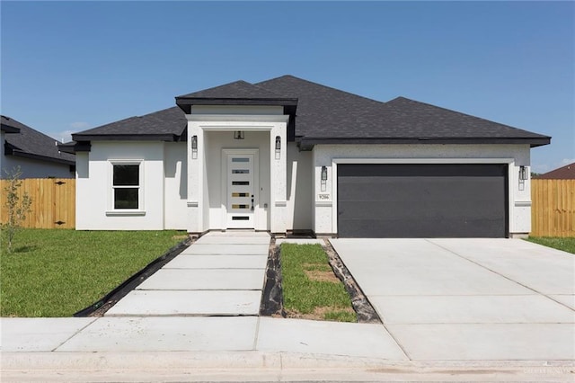 9206 N 25th Ln, Mcallen, TX 78504 - prairie-style house featuring a garage, roof with shingles, driveway, and stucco siding