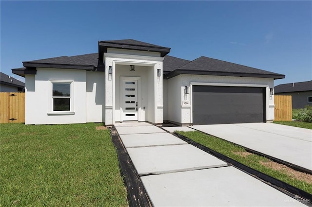 9206 N 25th Ln, Mcallen, TX 78504 - prairie-style home with an attached garage, driveway, stucco siding, and roof with shingles