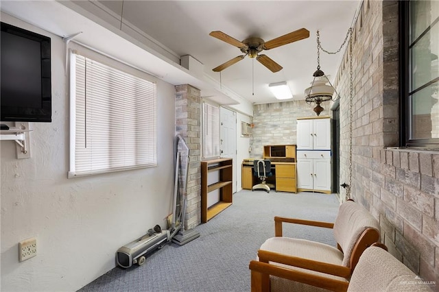 living room featuring carpet flooring and ceiling fan