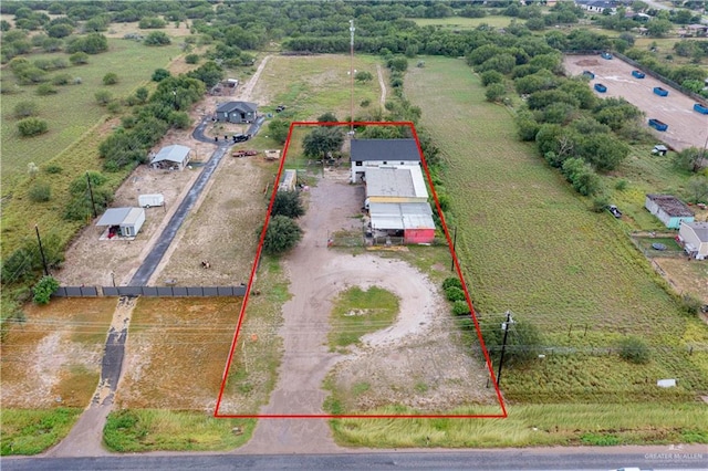 birds eye view of property with a rural view