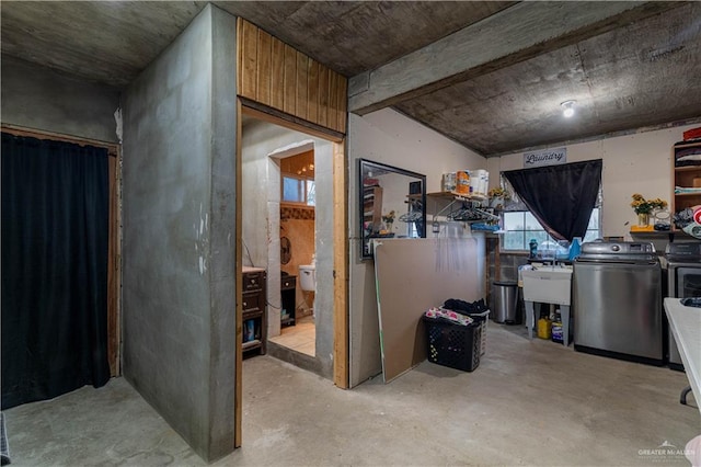 basement with sink and washer and dryer