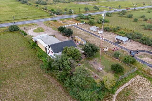 birds eye view of property featuring a rural view