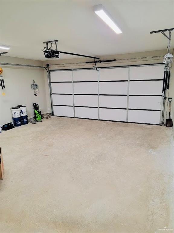 garage featuring a garage door opener