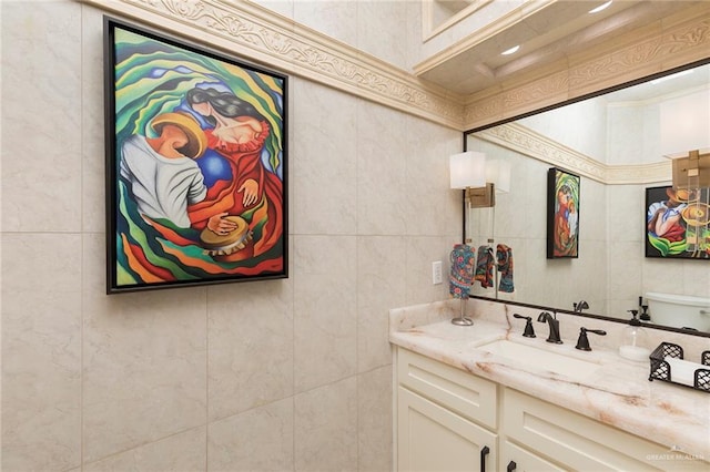 bathroom with tile walls and vanity