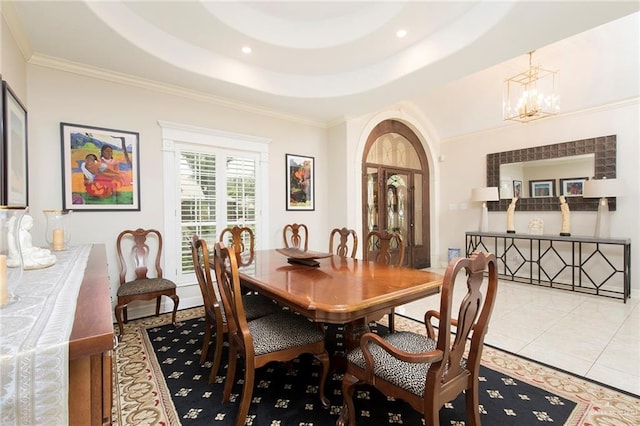 dining space featuring a chandelier, crown molding, a tray ceiling, baseboards, and light tile patterned floors