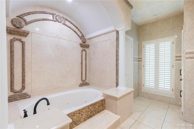 bathroom with decorative columns, a shower stall, a whirlpool tub, and tile patterned floors