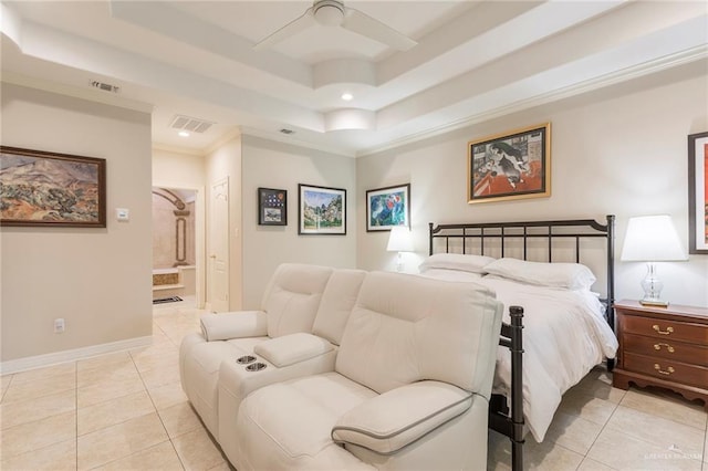 bedroom with light tile patterned floors, a tray ceiling, recessed lighting, ensuite bathroom, and crown molding