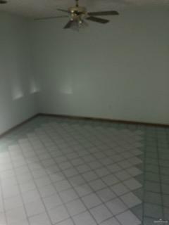 unfurnished room featuring light tile patterned floors