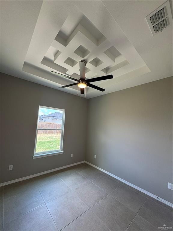 12711 N 37th Ln, Mcallen, TX 78504 - tiled empty room featuring a raised ceiling, a ceiling fan, and coffered ceiling