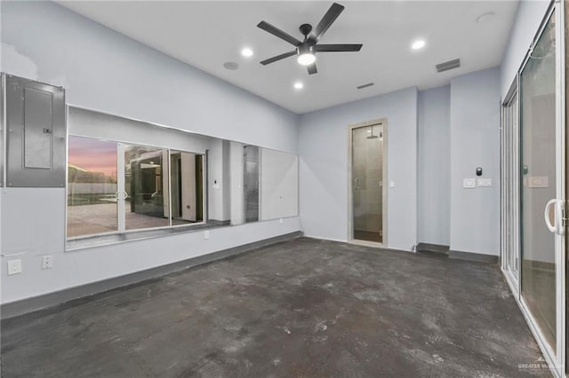 empty room featuring electric panel and ceiling fan