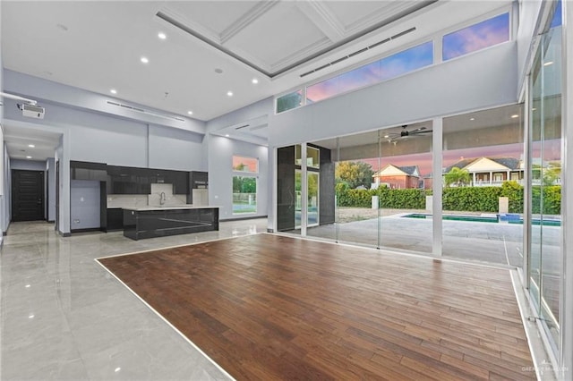 interior space featuring sink and a high ceiling