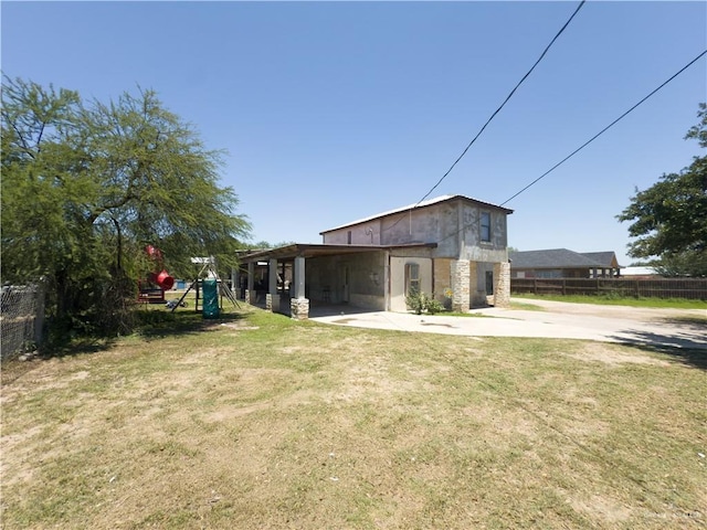 4810 Amber St, Mission, TX 78574 - back of house featuring driveway and a playground