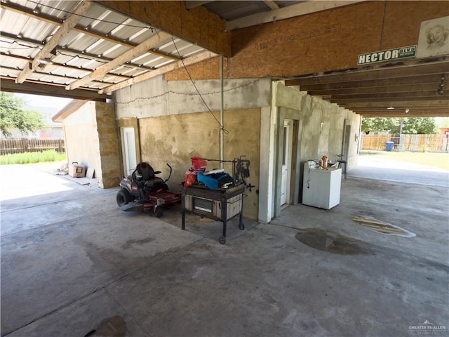 4810 Amber St, Mission, TX 78574 - garage featuring fence and refrigerator