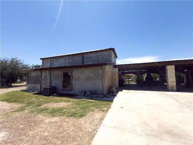 4810 Amber St, Mission, TX 78574 - view of front of house with central AC unit, driveway, and an attached carport