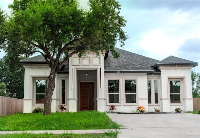 607 N 9th St, Alamo, TX 78516 - view of front of property with roof with shingles and stucco siding