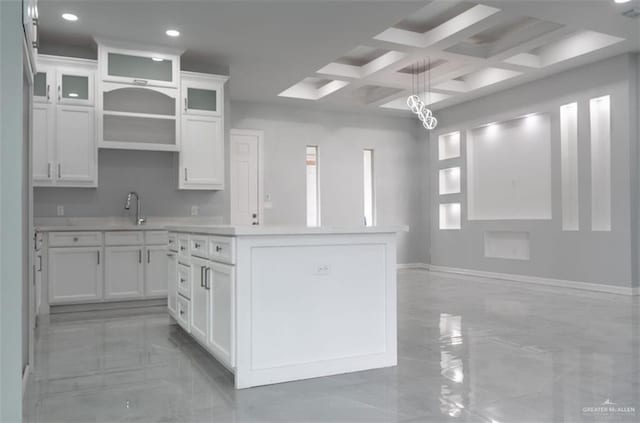 607 N 9th St, Alamo, TX 78516 - kitchen featuring a center island, white cabinetry, light countertops, recessed lighting, and hanging light fixtures