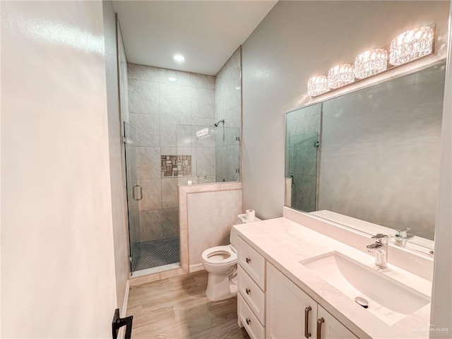 607 N 9th St, Alamo, TX 78516 - bathroom with vanity, a stall shower, wood finished floors, and recessed lighting