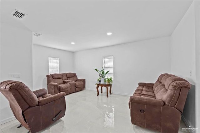 living room featuring plenty of natural light