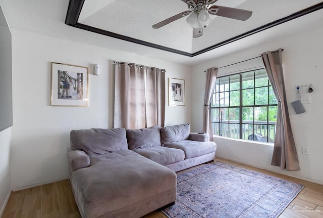 604 N Padre Ave, Weslaco, TX 78596 - living room with a ceiling fan, wood finished floors, and baseboards