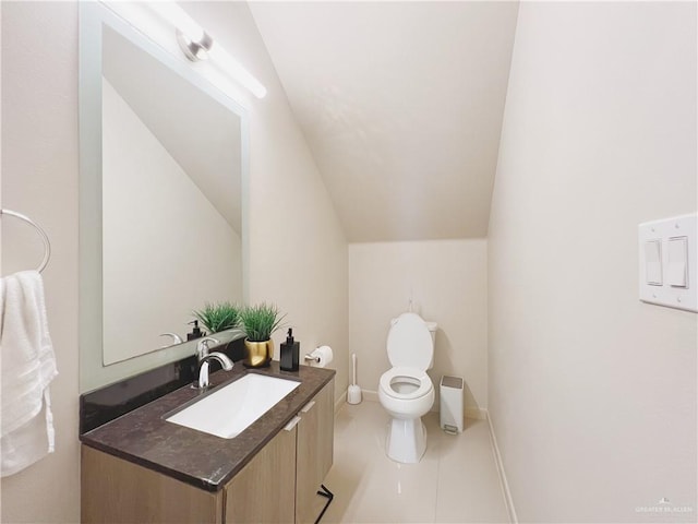 1510 S Bilboa St Unit 1, Pharr, TX 78577 - bathroom featuring vanity, toilet, tile patterned floors, lofted ceiling, and baseboards