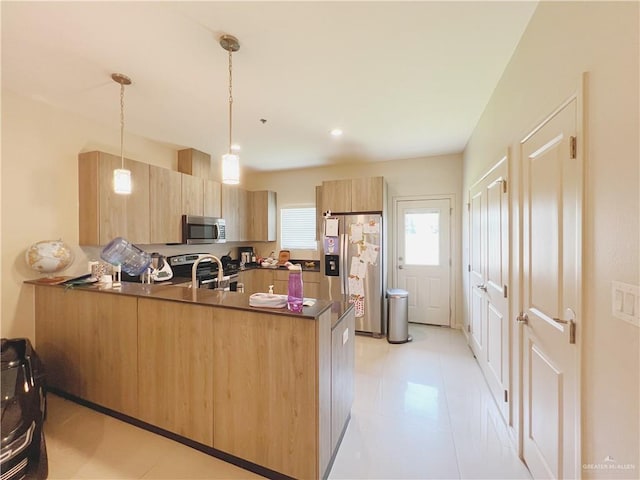 1510 S Bilboa St Unit 1, Pharr, TX 78577 - kitchen with appliances with stainless steel finishes, a peninsula, light brown cabinetry, dark countertops, and modern cabinets